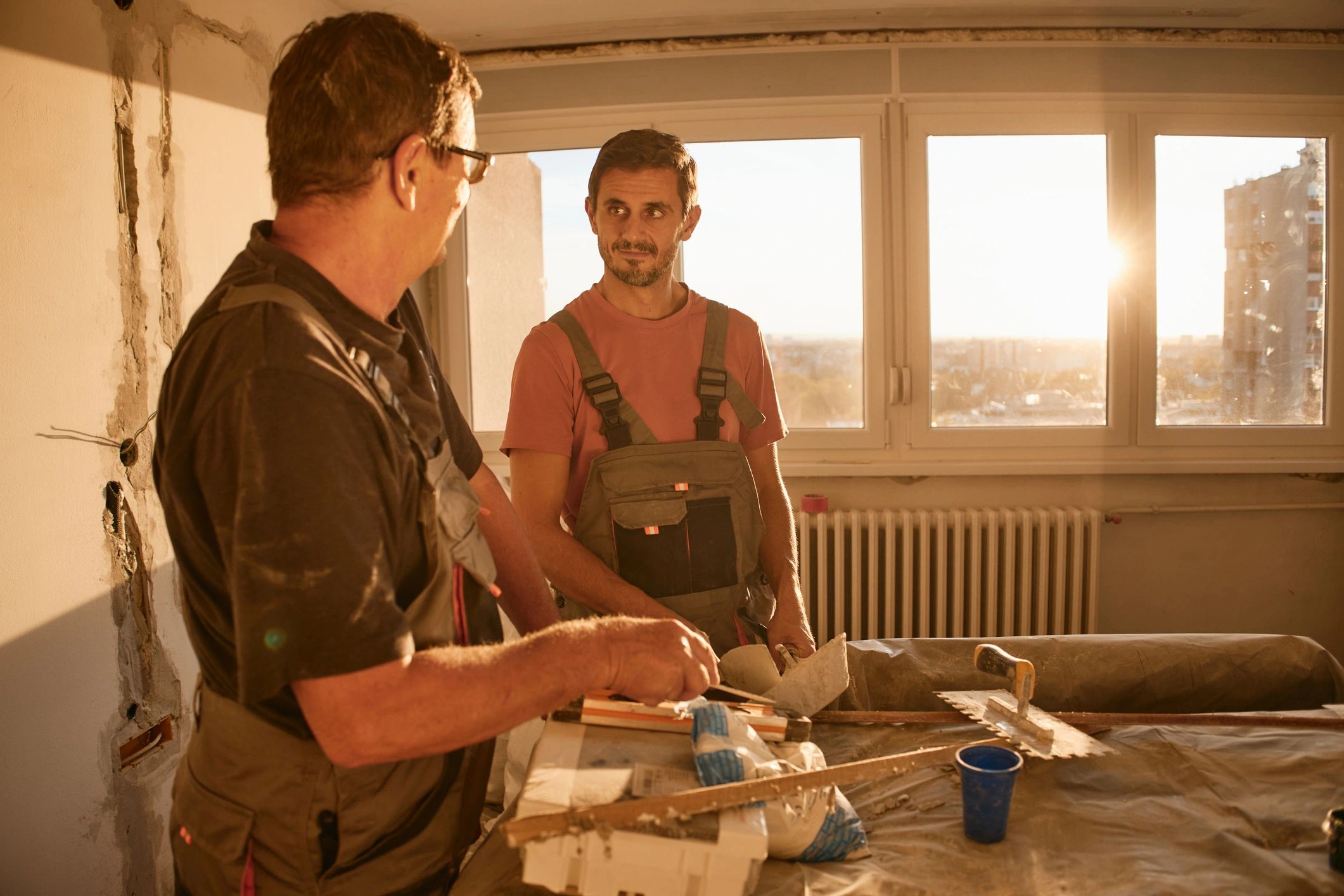 Painting professionals discussing project details and prep